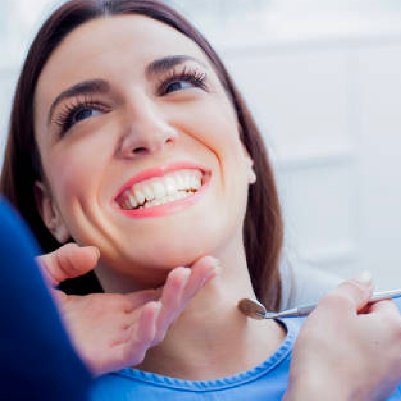 Young woman smiling at the dentist