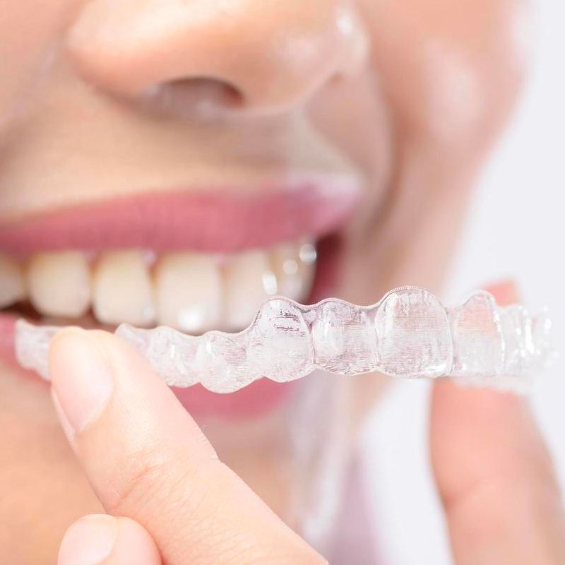 smiling with invisalign in