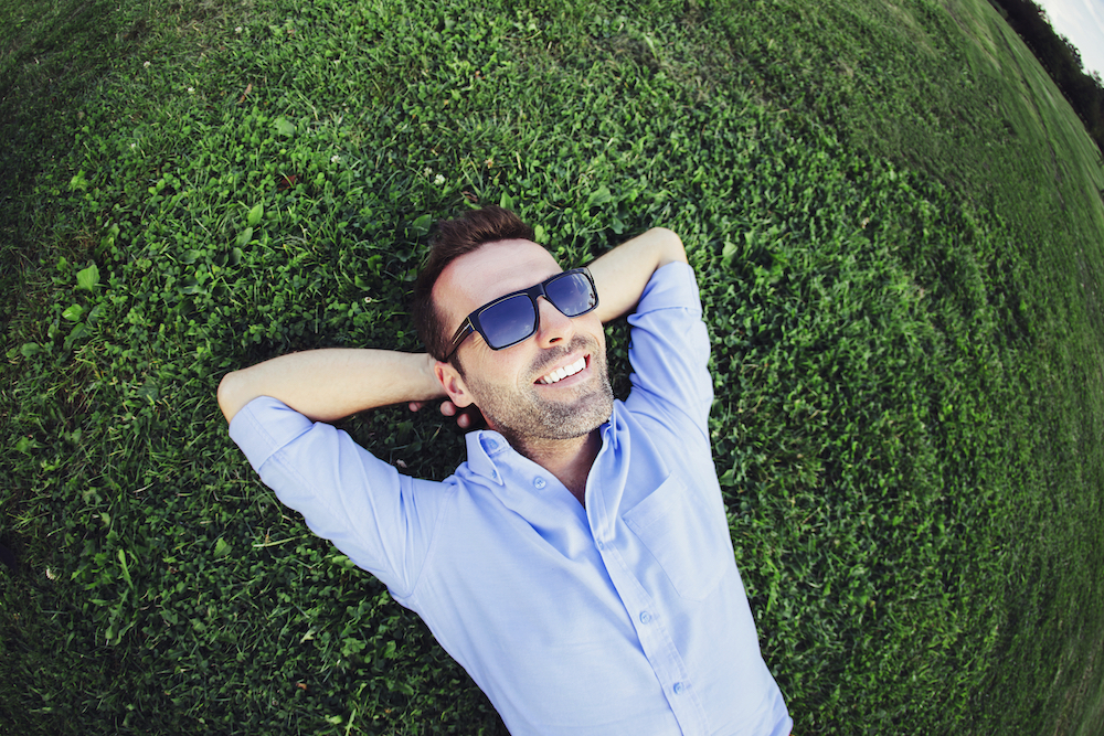 guy Smiling Laying in Grass