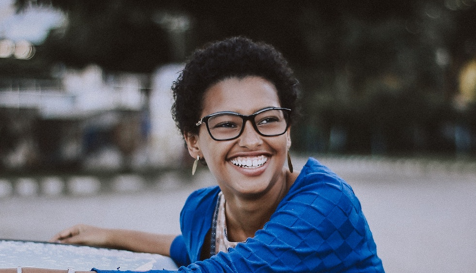 women-glasses-outside happy with veneers 